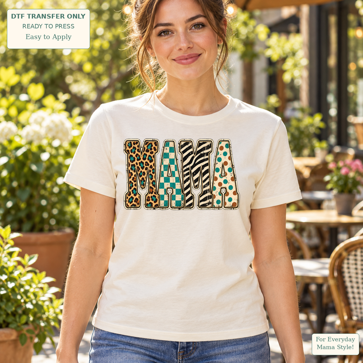 Woman wearing a cream tee with MAMA letters in leopard, teal checkerboard, zebra and spotted patterns.