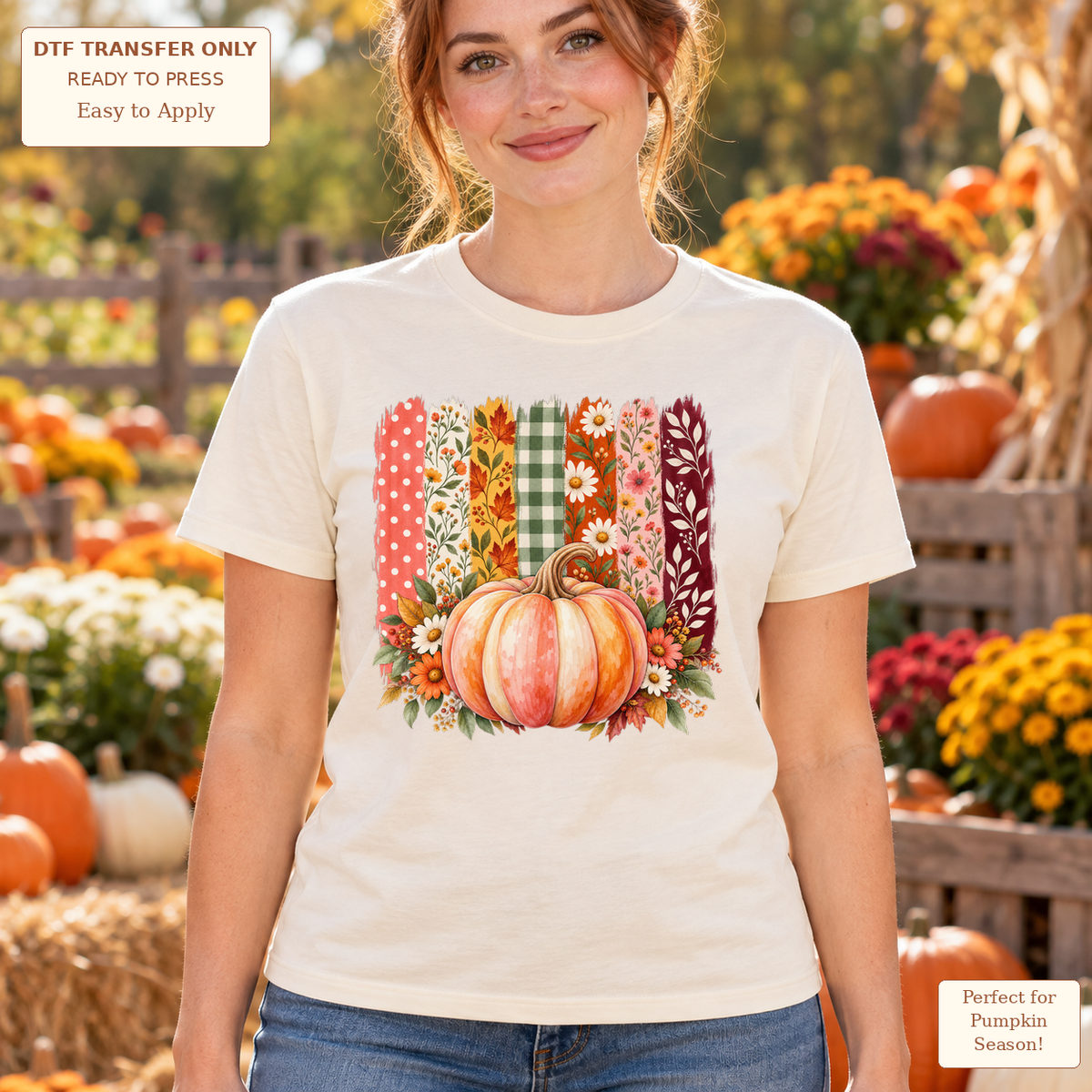Woman wearing a cream tee with a pink-orange pumpkin, flowers and vertical floral, gingham and leaf-patterned strips.