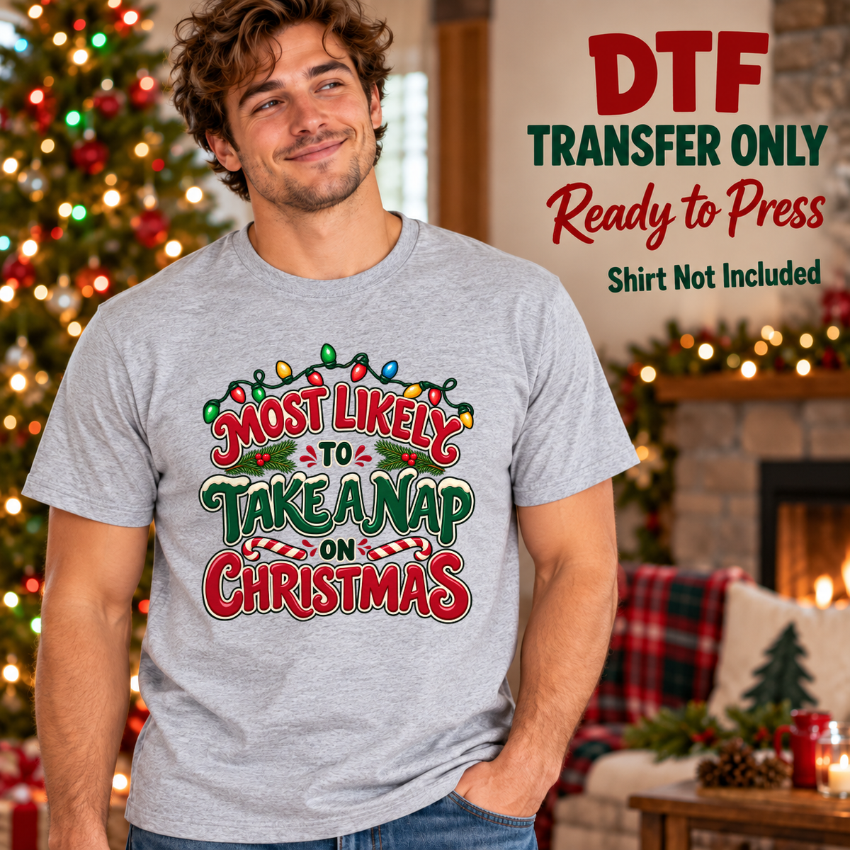 Man wearing a gray tee with red and green Most Likely to Take a Nap on Christmas lettering and colorful lights.