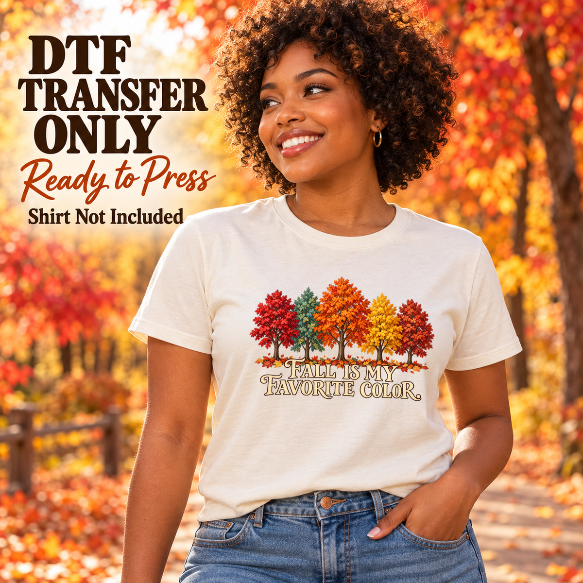 Woman wearing a white tee with colorful autumn trees above Fall Is My Favorite Color lettering.