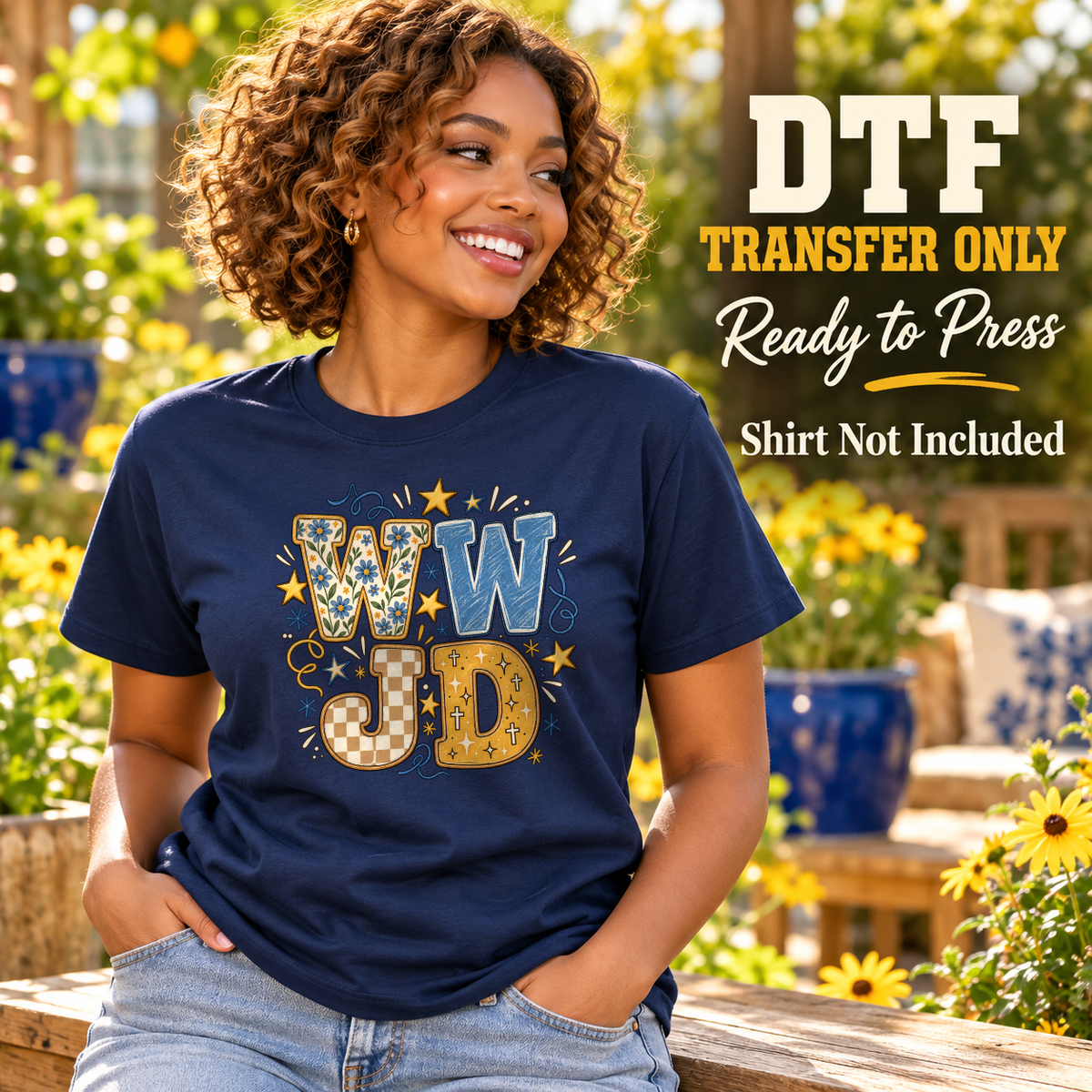 Woman in a navy tee with blue and gold patterned WWJD block letters, small stars and decorative accents.