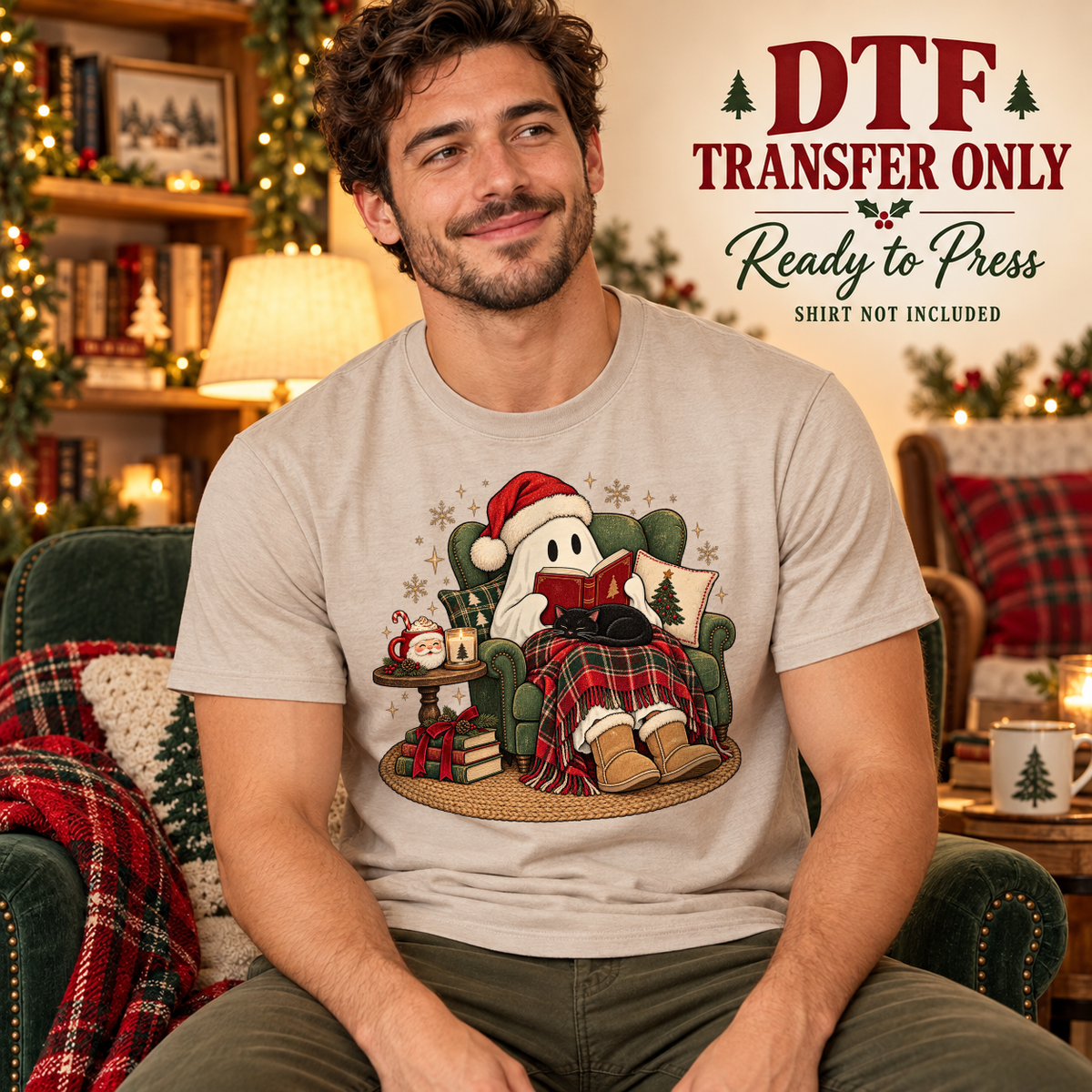 Man wearing a beige tee with a ghost in a Santa hat reading in a green armchair under a plaid blanket.