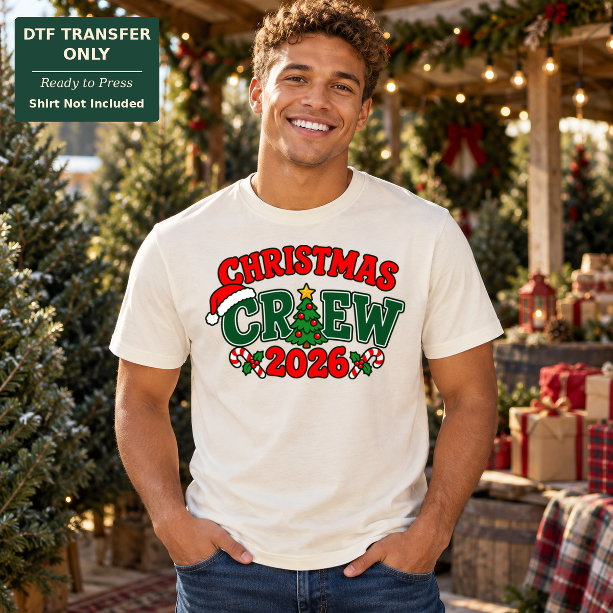 Man wearing a cream tee with red and green Christmas Crew 2026 lettering, a Santa hat, Christmas tree and candy canes.