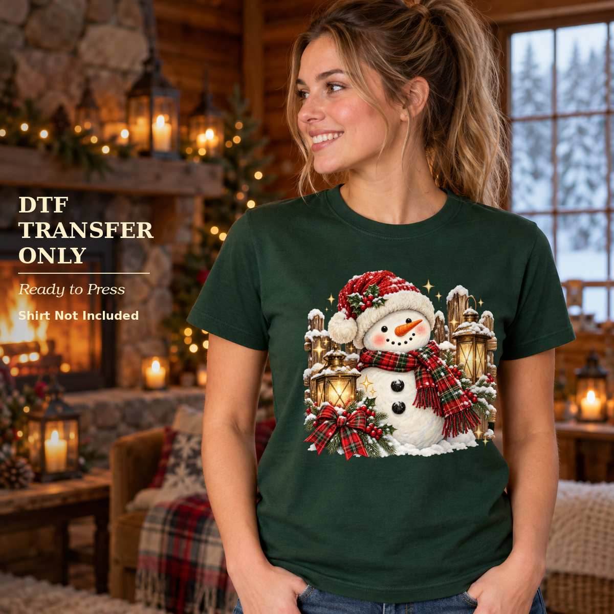 Woman wearing a dark green shirt with a smiling snowman, plaid bows, and lanterns inside a snowy cabin.