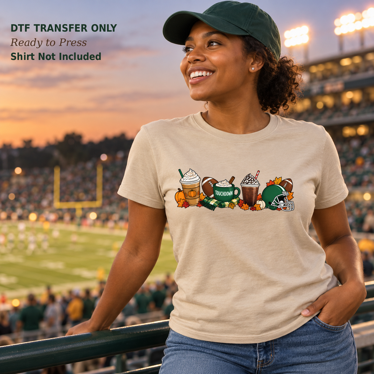 Woman in a tan shirt with fall coffee drinks, a Touchdown mug, footballs, pumpkins, and a green helmet at a football stadium.