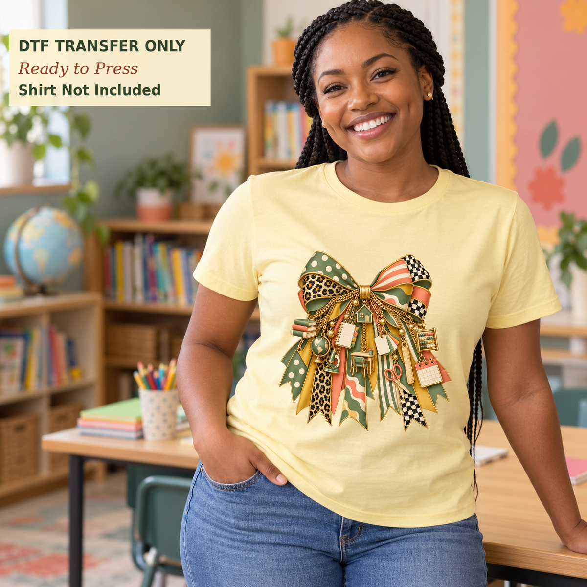 Woman wearing a pale yellow shirt with a large mixed-print bow and illustrated gold-tone school supply charms in a classroom.