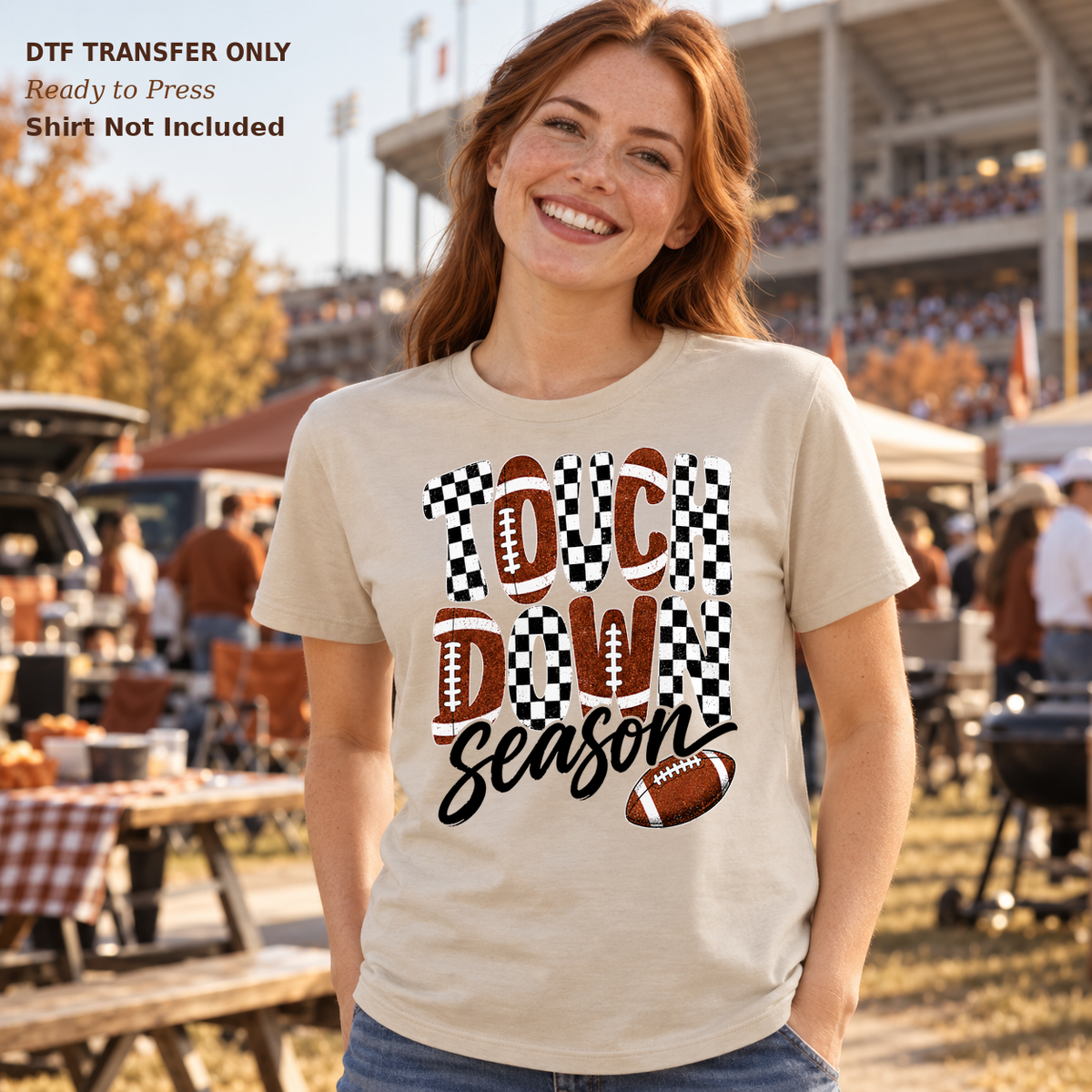 Woman in a light tee showing Touchdown Season lettering with light script, checkerboard and footballs.
