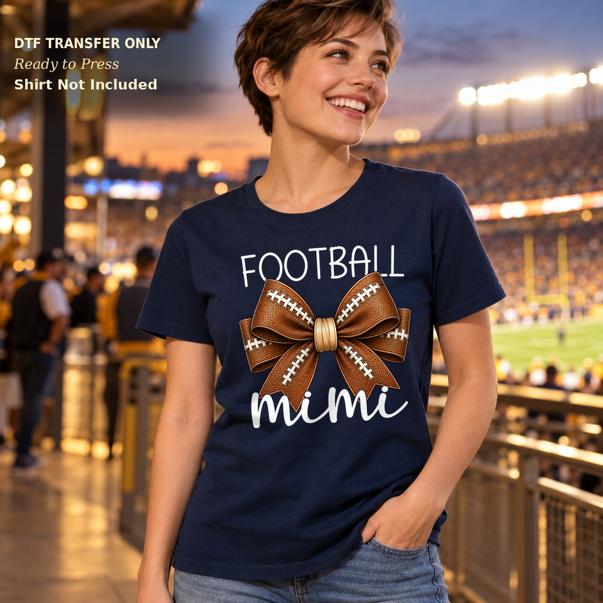Woman in a navy tee with Football Mimi lettering in light script and a brown football bow.