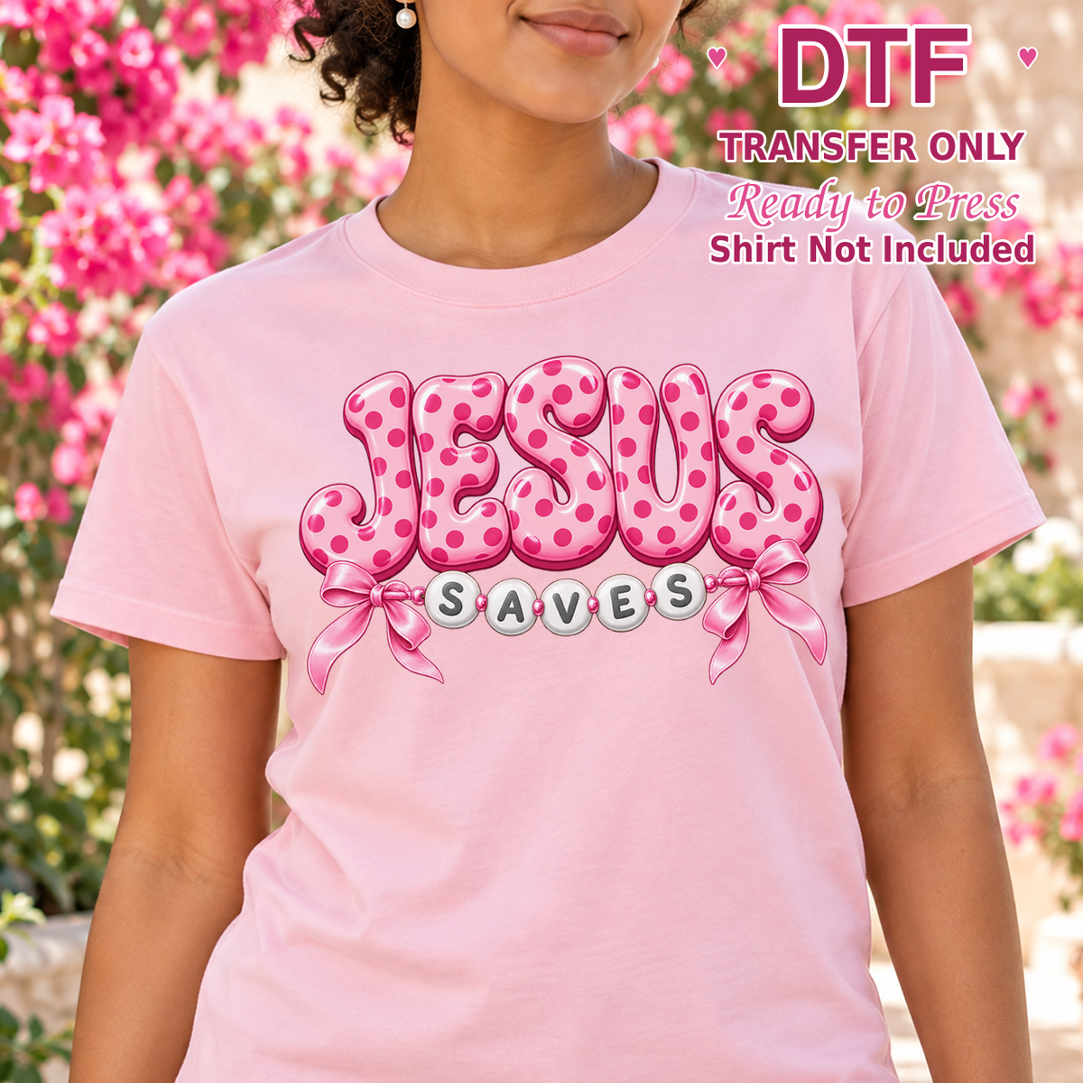 Woman in a pink tee with patterned pink JESUS lettering, bows and SAVES beneath.