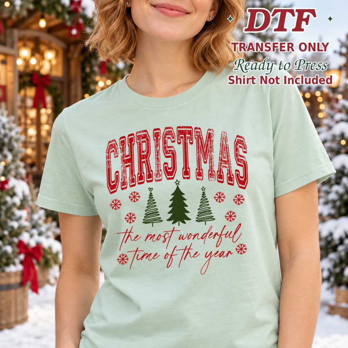 Woman in a mint tee with CHRISTMAS, trees and The most wonderful time of the year script.