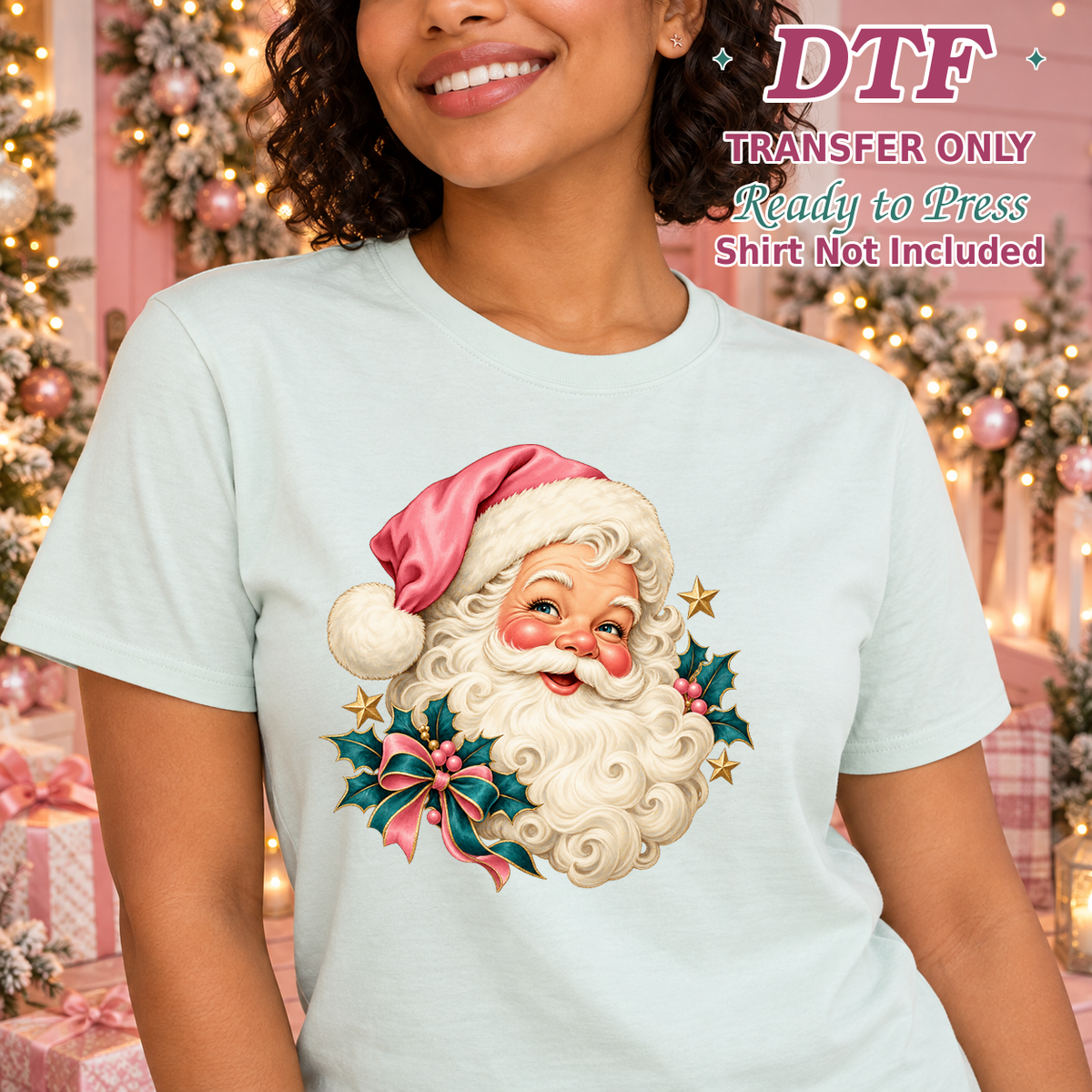 Woman in a light blue tee showing Santa in a pink hat with holly and berries.