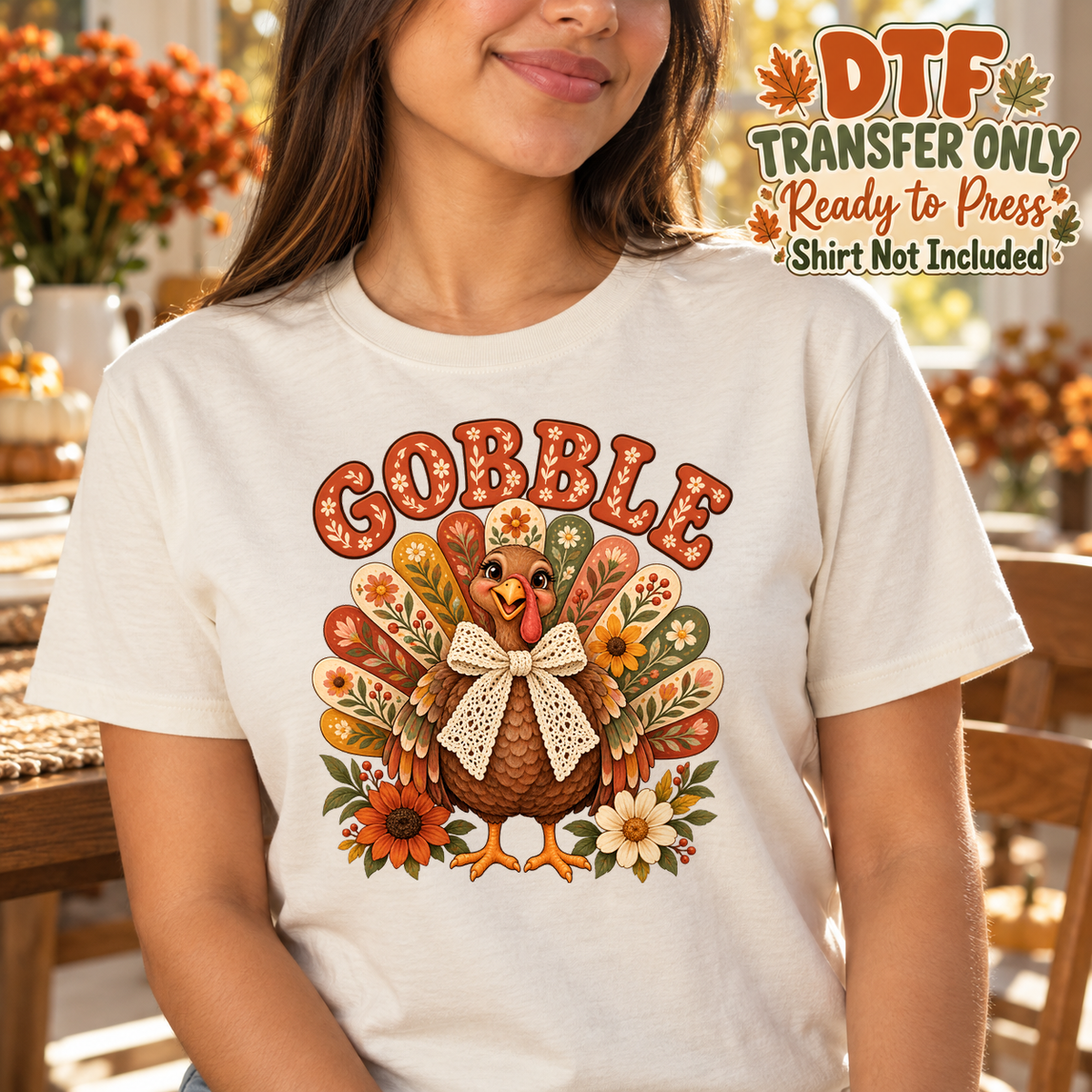 Woman in a cream tee with Gobble text and a patchwork turkey wearing a bow.