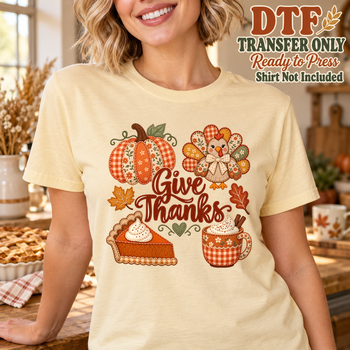Woman in a yellow tee with Give Thanks script, a pumpkin, turkey, pie and mug.