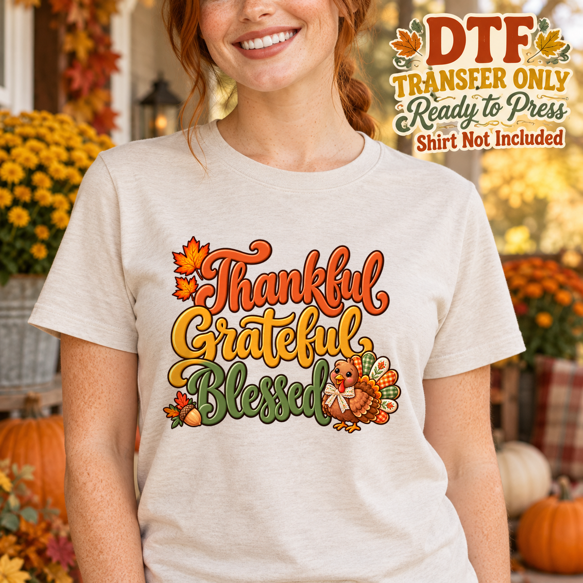 Woman in a light tee with Thankful Grateful Blessed lettering, autumn leaves and a turkey.