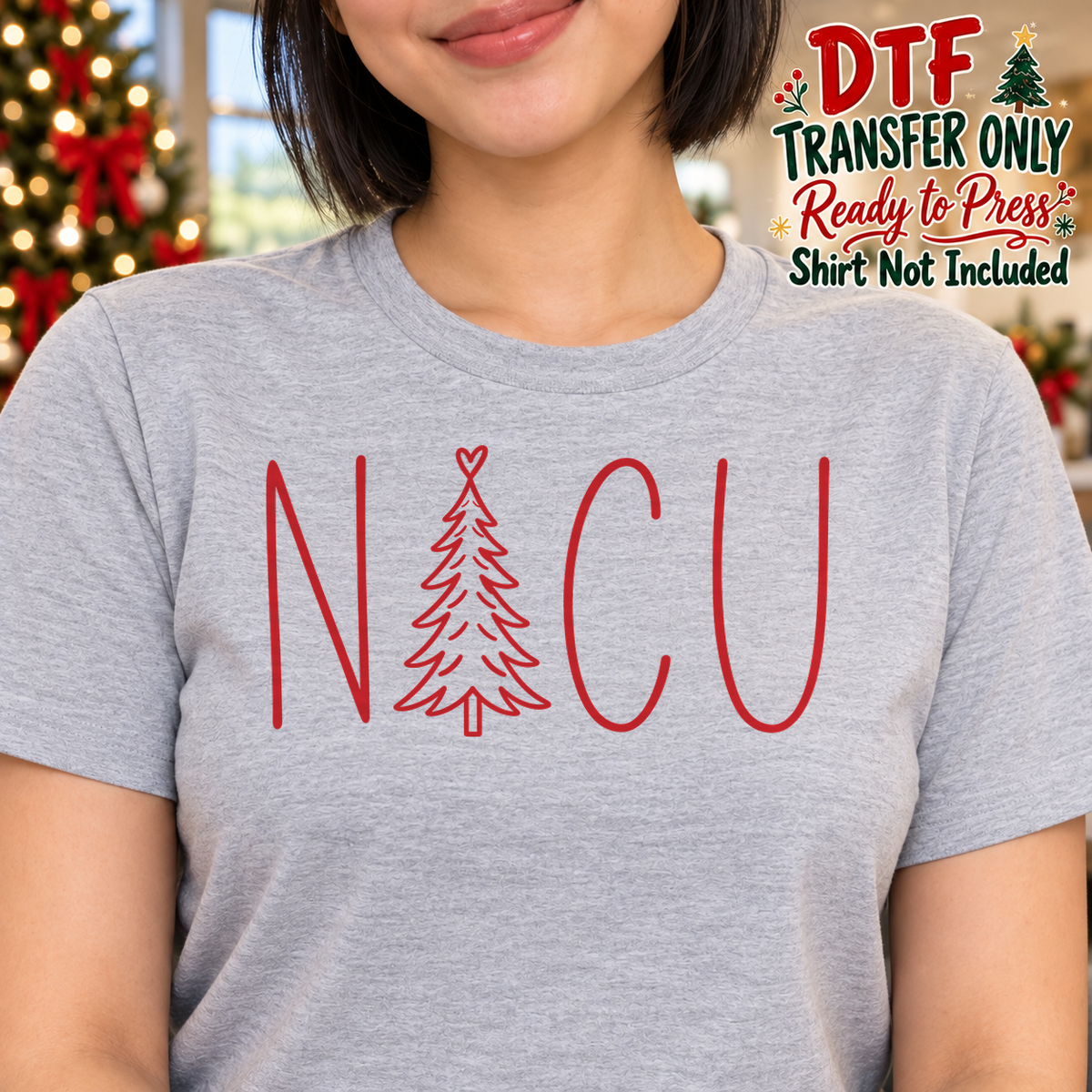 Woman in a gray tee with red NICU lettering incorporating a Christmas tree.