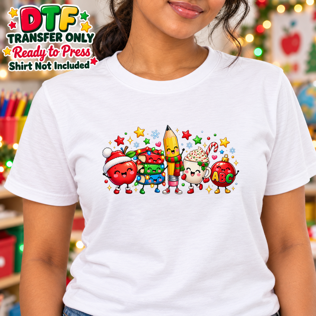 Woman in a white tee with smiling apple, books, pencil, holiday drink and ABC ornament characters.