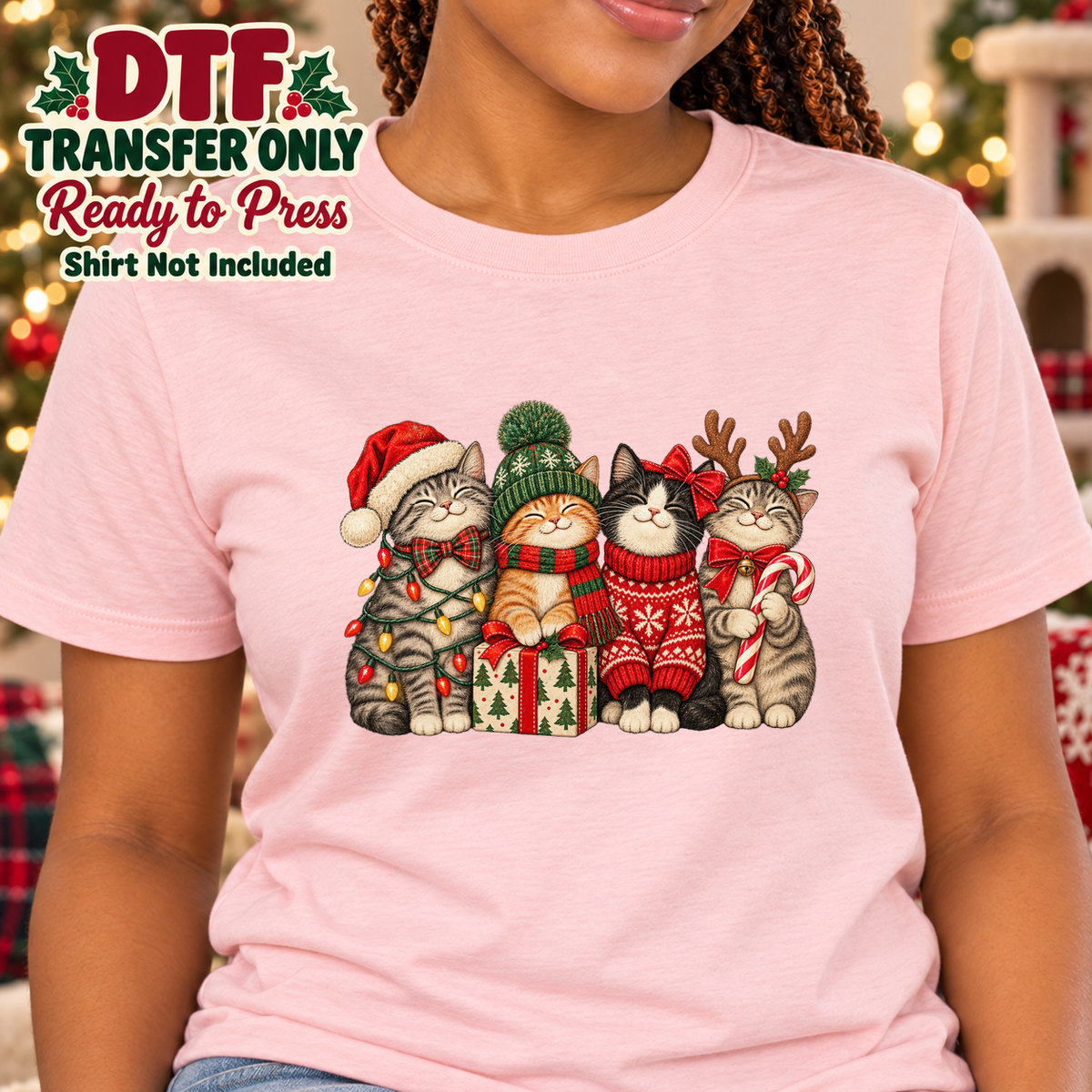 Woman in a pink tee displaying four Christmas cats in festive hats and sweaters, with transfer-only text.