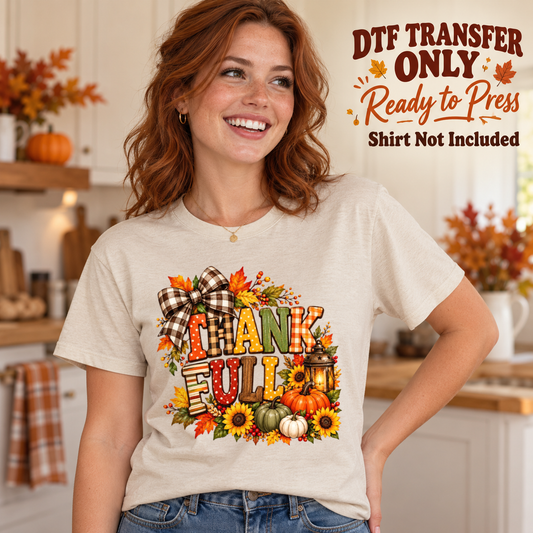 Woman in an ivory tee showing stacked Thankful lettering with a plaid bow, pumpkins and autumn flowers, labeled transfer only.
