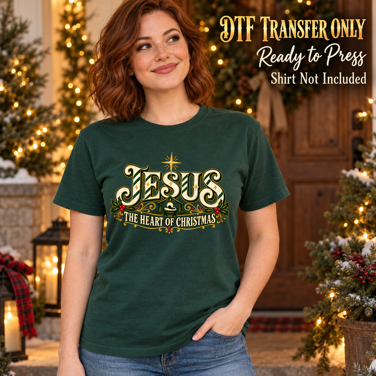 Woman in a dark green tee with ornate gold-style Jesus lettering, a star and The Heart of Christmas wording, labeled transfer only.