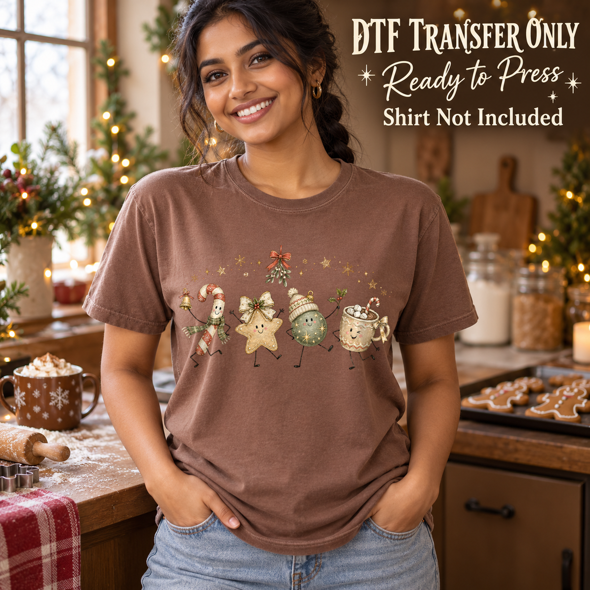 Woman in a brown tee displaying cute Christmas treat characters including a gingerbread star and hot cocoa mug, labeled transfer only.