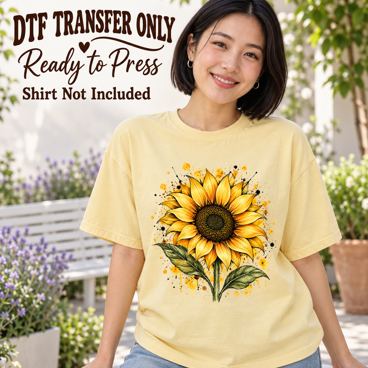 Woman in a pale yellow tee with a large yellow sunflower, green leaves and watercolor-style splashes, labeled DTF transfer only.