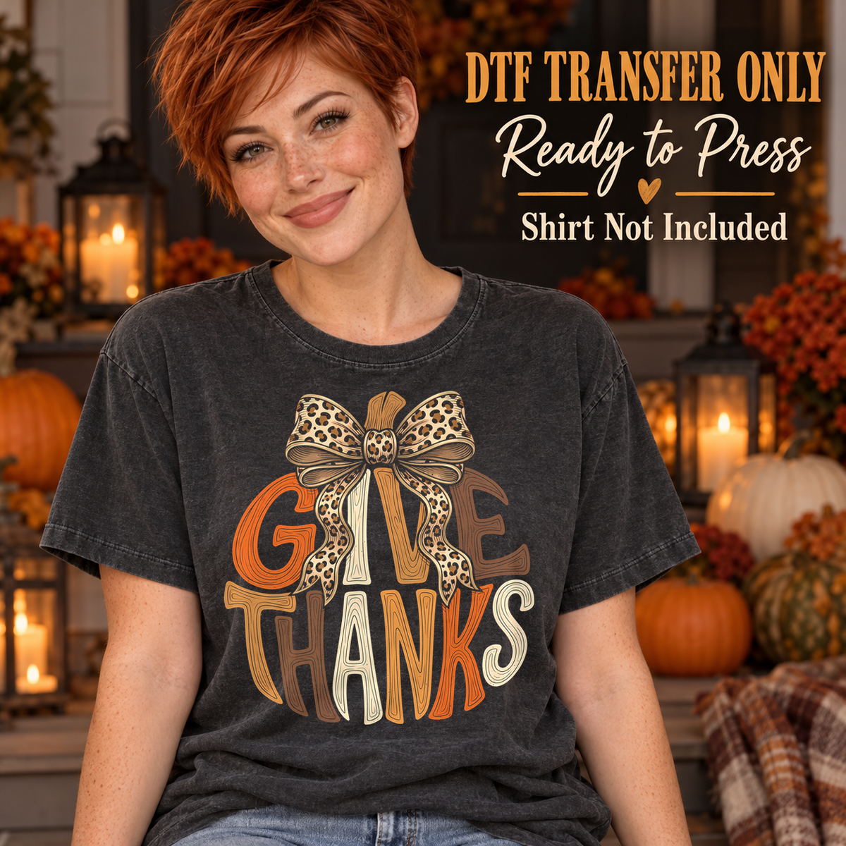 Woman in a charcoal washed tee with orange and tan Give Thanks lettering and a leopard-print bow, labeled DTF transfer only.