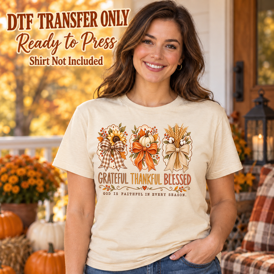 Woman in an ivory tee with three harvest bows, sunflowers and Grateful Thankful Blessed wording above God Is Faithful in Every Season, labeled transfer only.