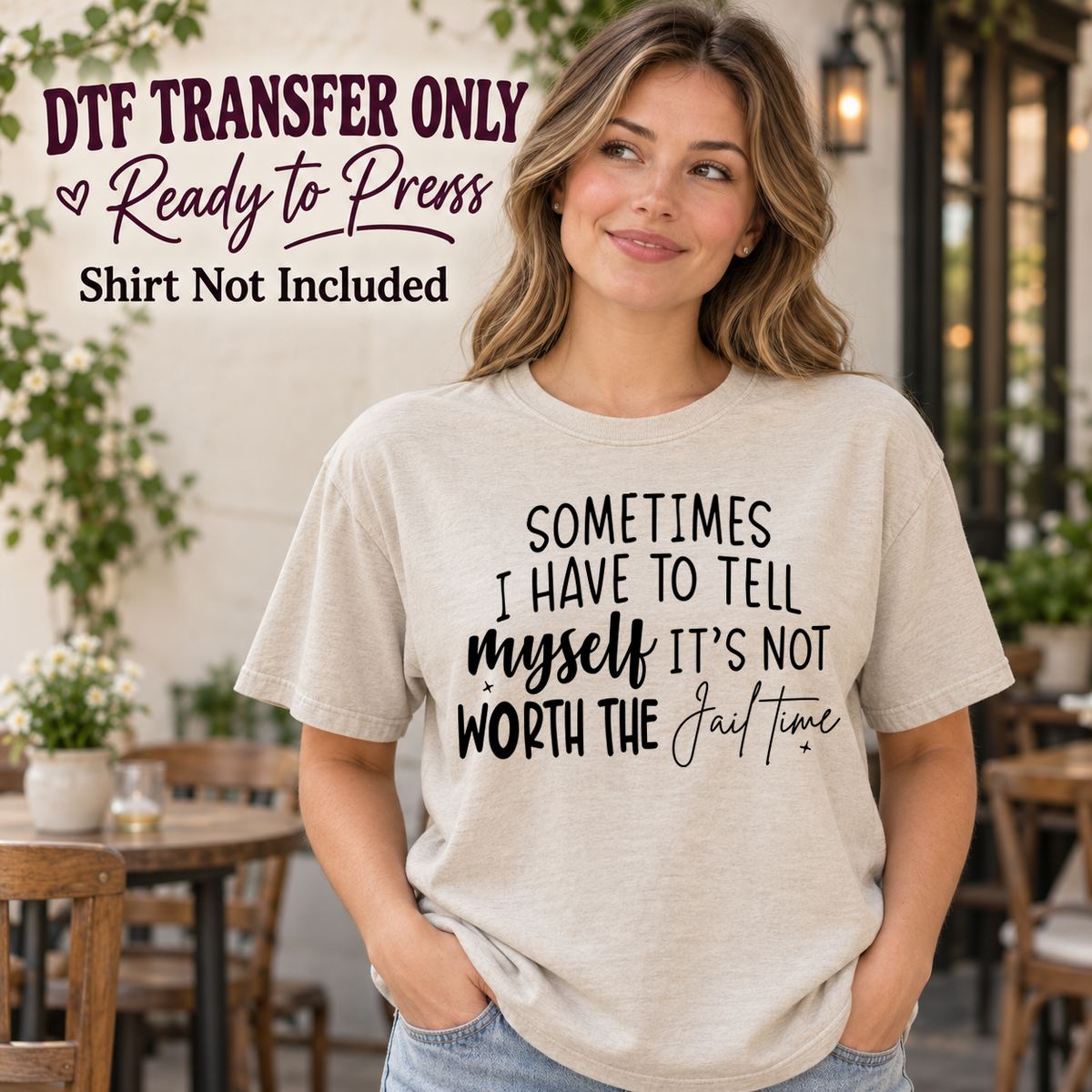 Woman in an ivory tee with black Sometimes I Have to Tell Myself It's Not Worth the Jail Time text in mixed script and print, labeled transfer only.