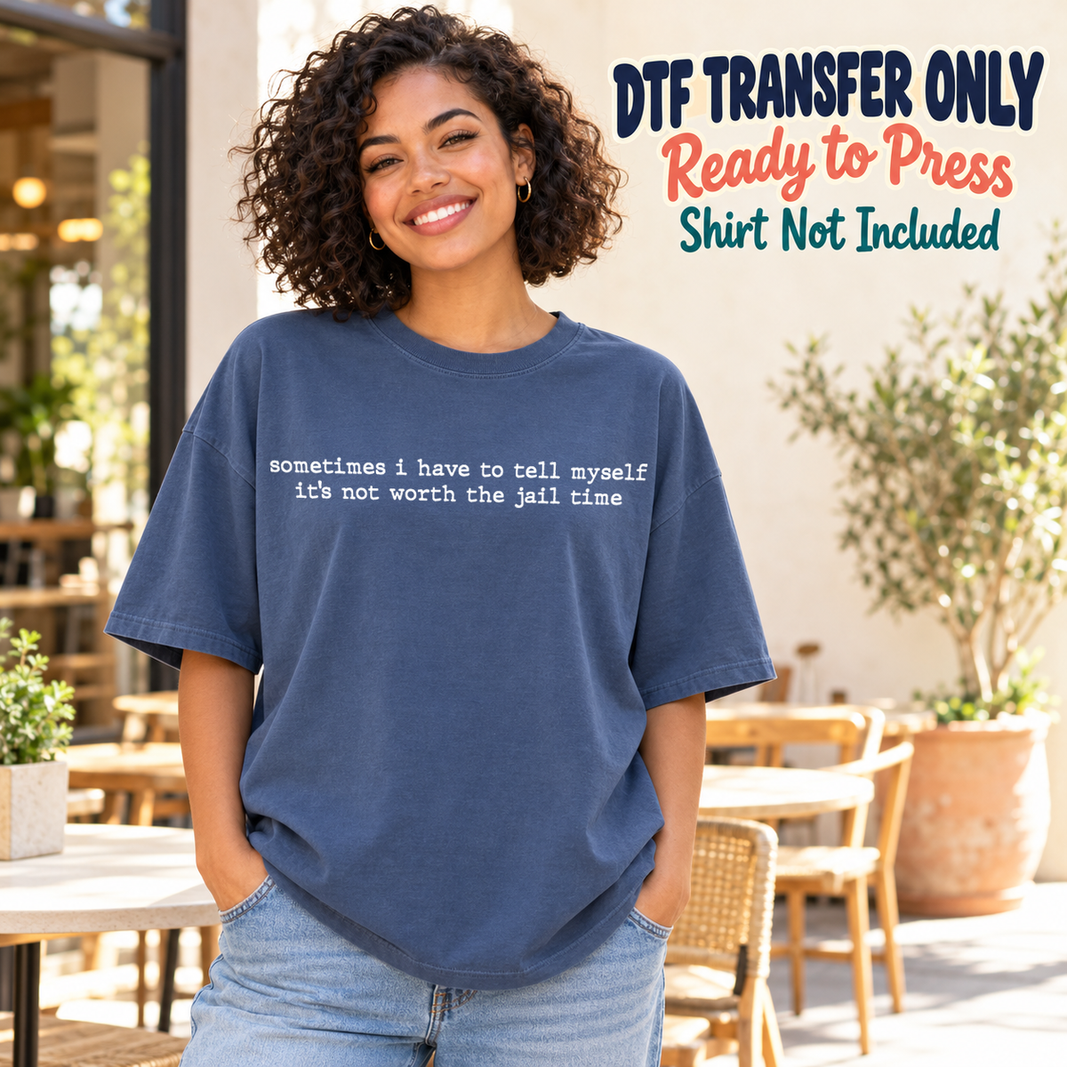 Woman in a navy tee with small white typewriter-style Sometimes I Have to Tell Myself It's Not Worth the Jail Time text, labeled transfer only.