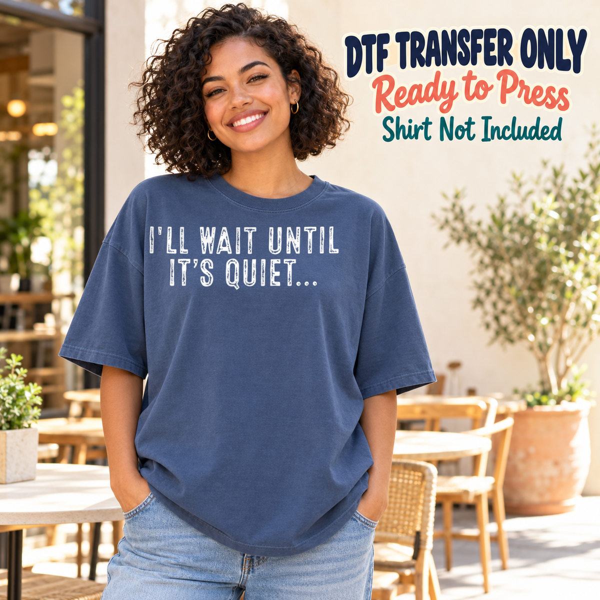 Woman in a navy tee displaying white I'll Wait Until It's Quiet lettering with trailing dots, labeled DTF transfer only.