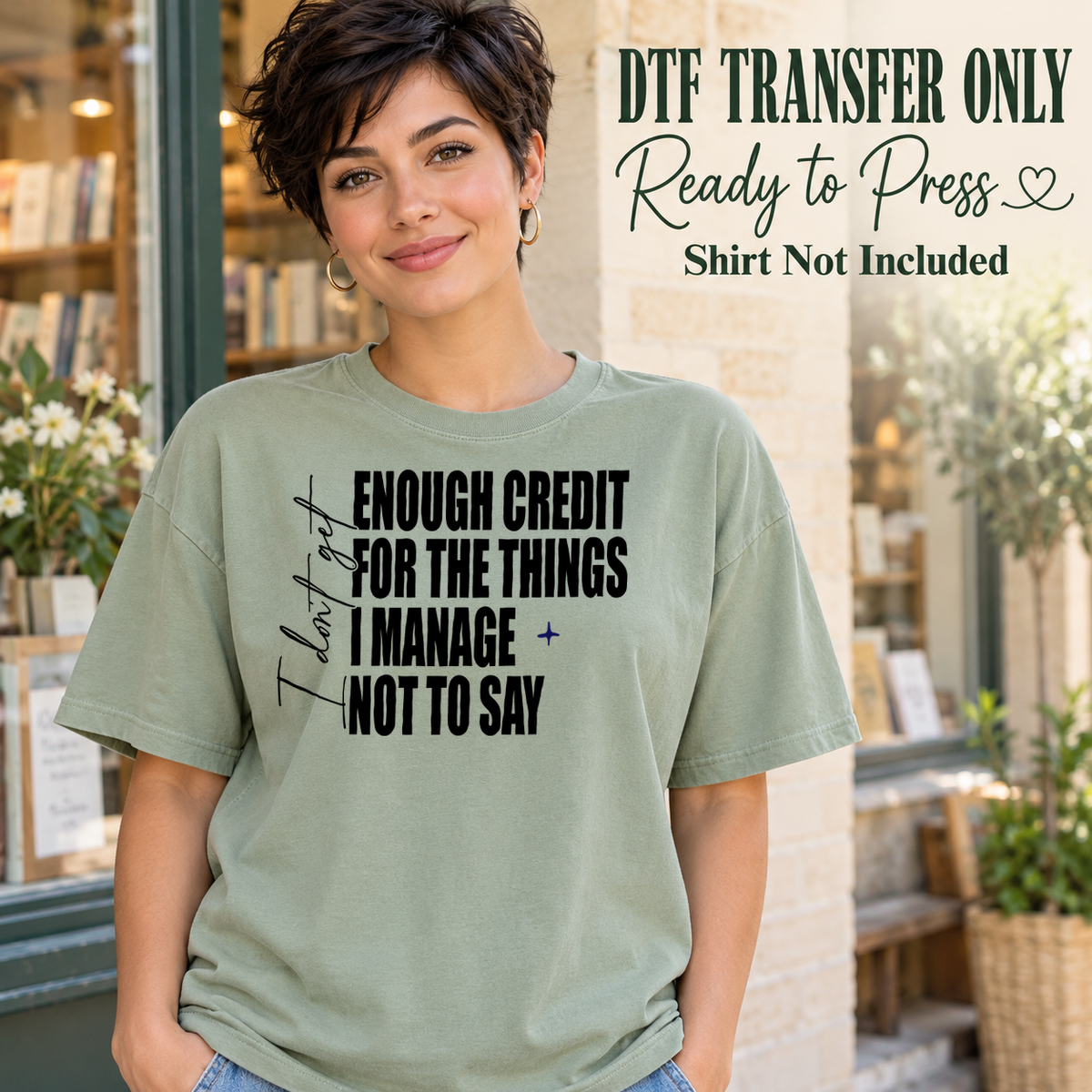 Woman in a sage green tee displaying I Don't Get Enough Credit for the Things I Manage Not to Say in black mixed lettering, labeled transfer only.