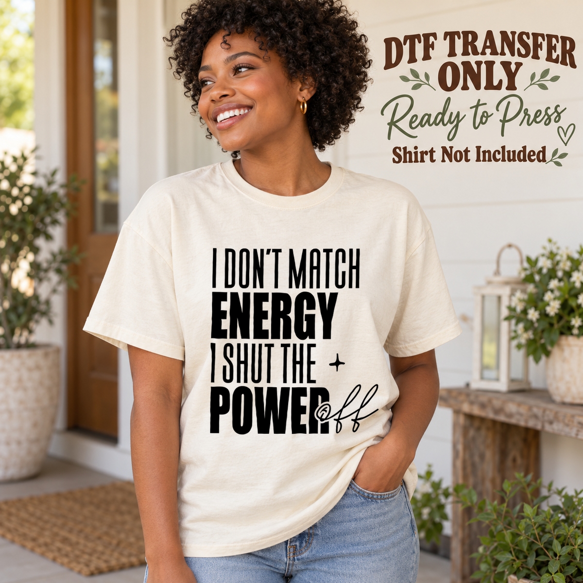 Woman in an ivory tee with black I Don't Match Energy I Shut the Power Off lettering, labeled DTF transfer only.