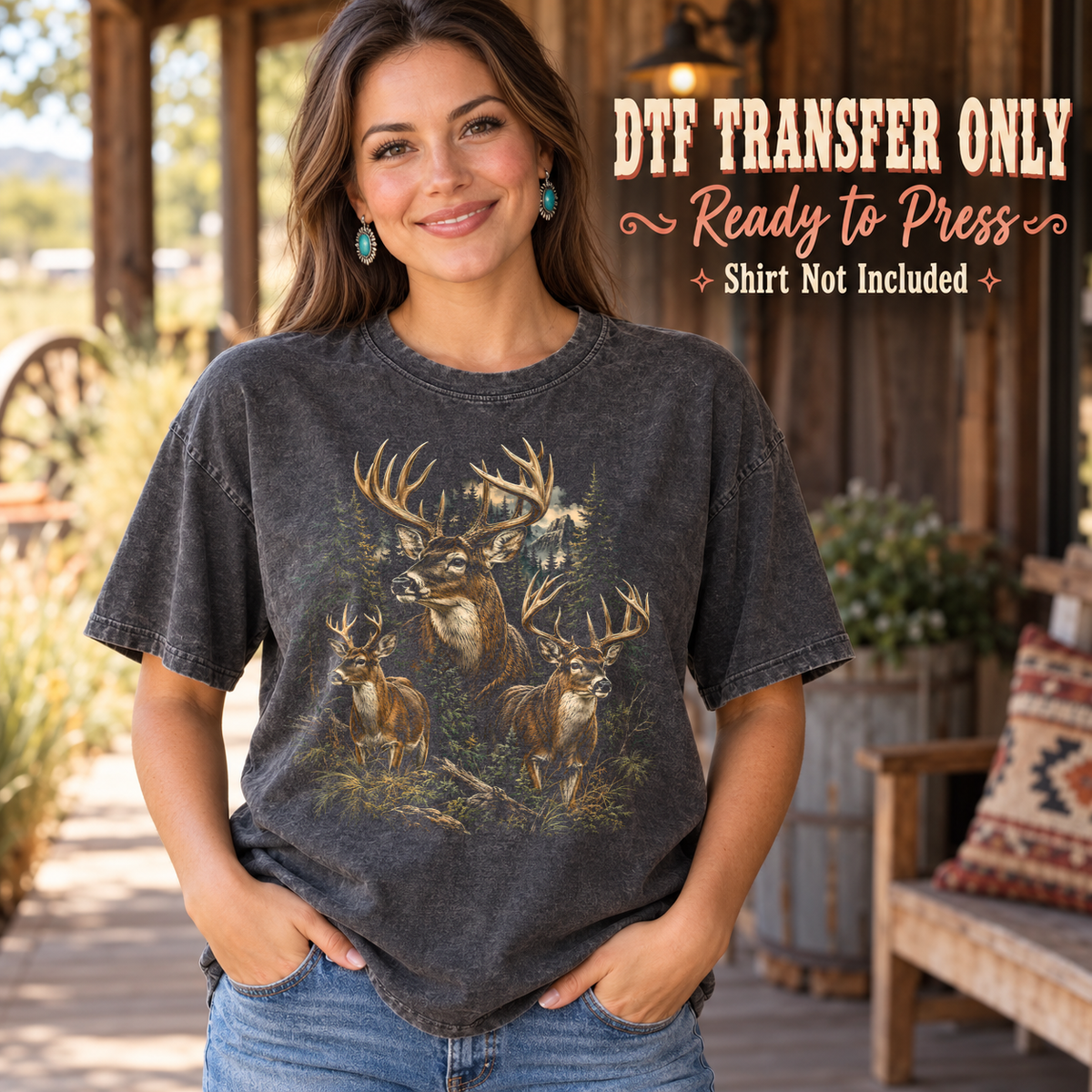 Woman in a charcoal washed tee with a detailed collage of antlered bucks in a dark woodland setting, labeled DTF transfer only.