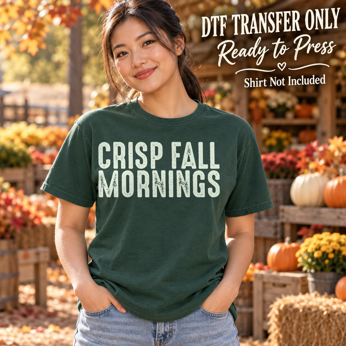Woman in a dark green tee with cream distressed Crisp Fall Mornings lettering, labeled DTF transfer only.