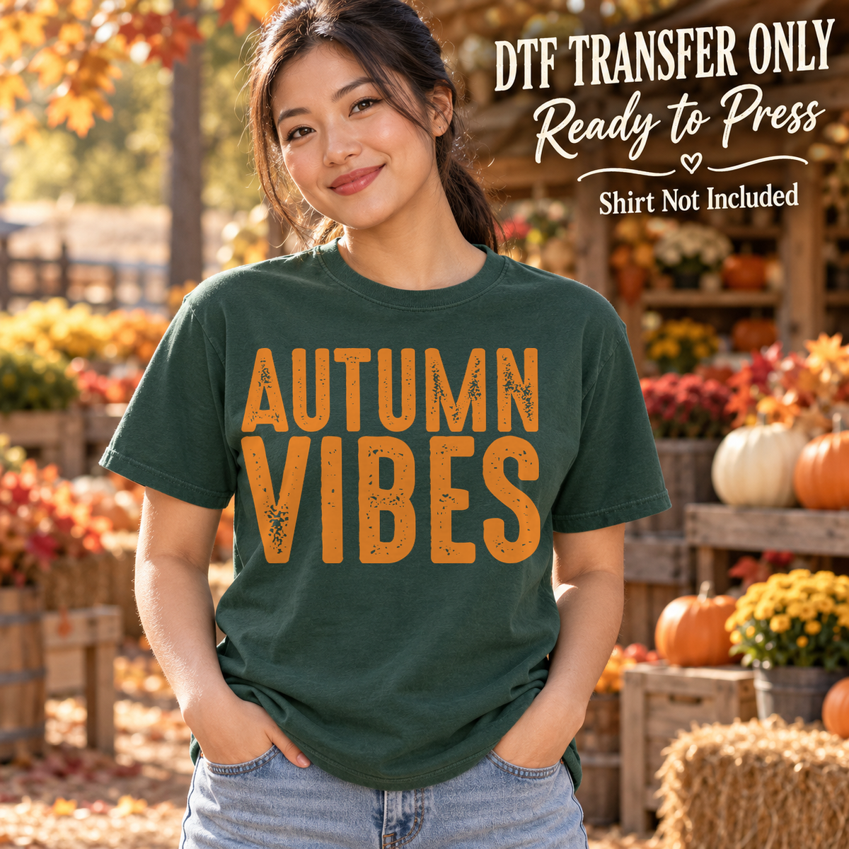 Woman in a dark green tee with orange distressed Autumn Vibes lettering, labeled DTF transfer only.