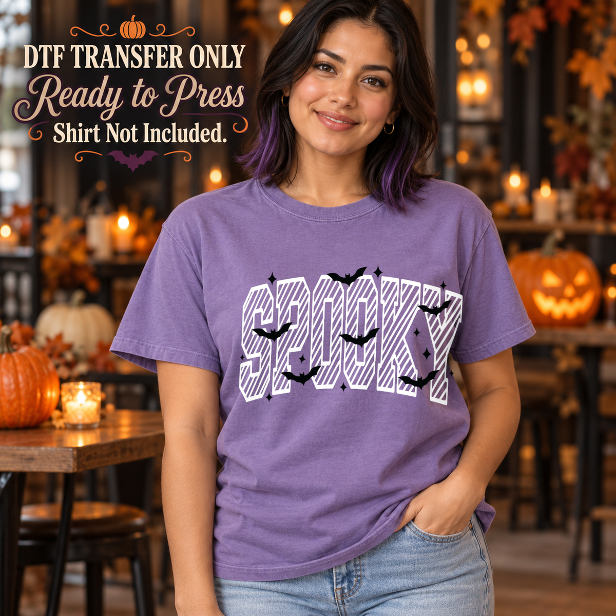 Large striped SPOOKY lettering with small Halloween accents, shown on a purple shirt model mockup; physical DTF transfer only, shirt not included.
