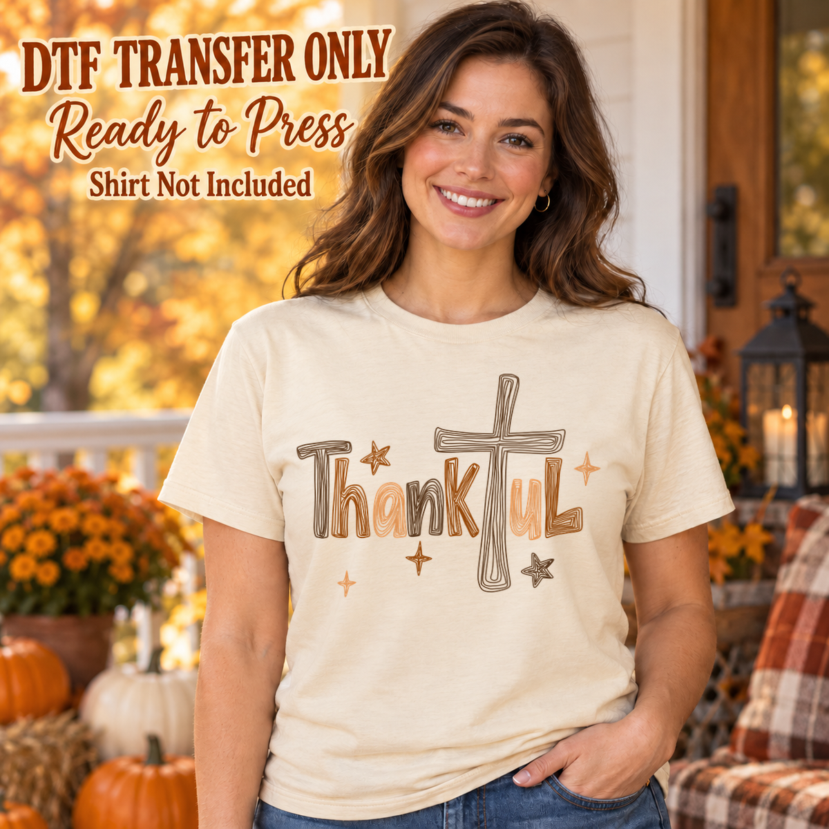 Thankful lettering with a cross and small autumn accents, shown on a cream shirt model mockup; physical DTF transfer only, shirt not included.