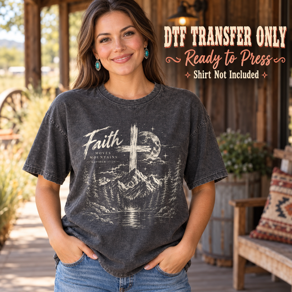 Light Faith script and cross above a mountain and forest scene, shown on a charcoal shirt model mockup; physical DTF transfer only, shirt not included.