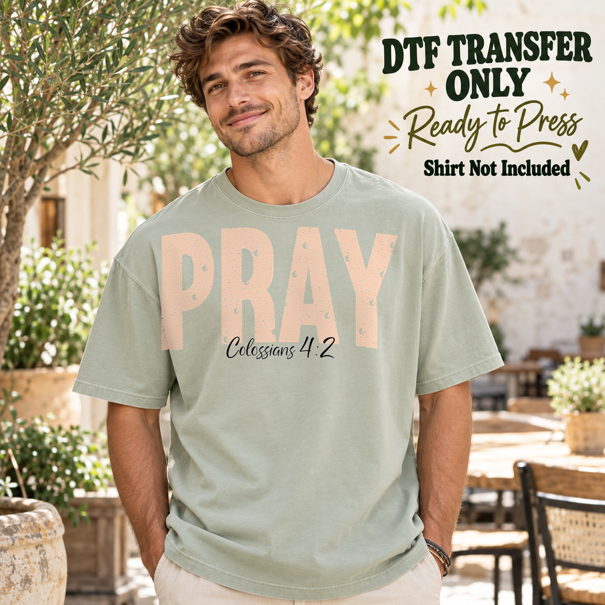 Peach PRAY block lettering with Colossians 4:2 script, shown on a sage green shirt model mockup; physical DTF transfer only, shirt not included.