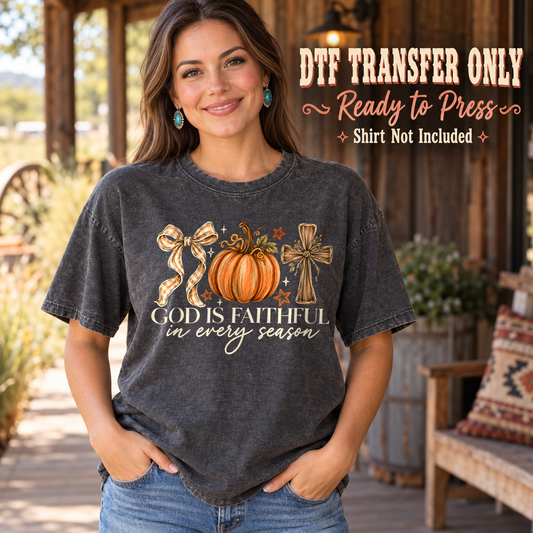 Pumpkin, bow and cross above God Is Faithful in Every Season lettering, shown on a charcoal shirt model mockup; physical DTF transfer only, shirt not included.