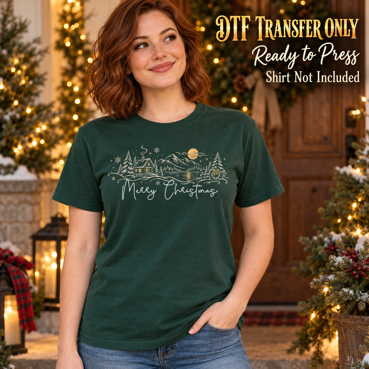 Light line-art winter village and trees with moon above Merry Christmas script, shown on a dark green shirt model mockup; physical DTF transfer only, shirt not included.