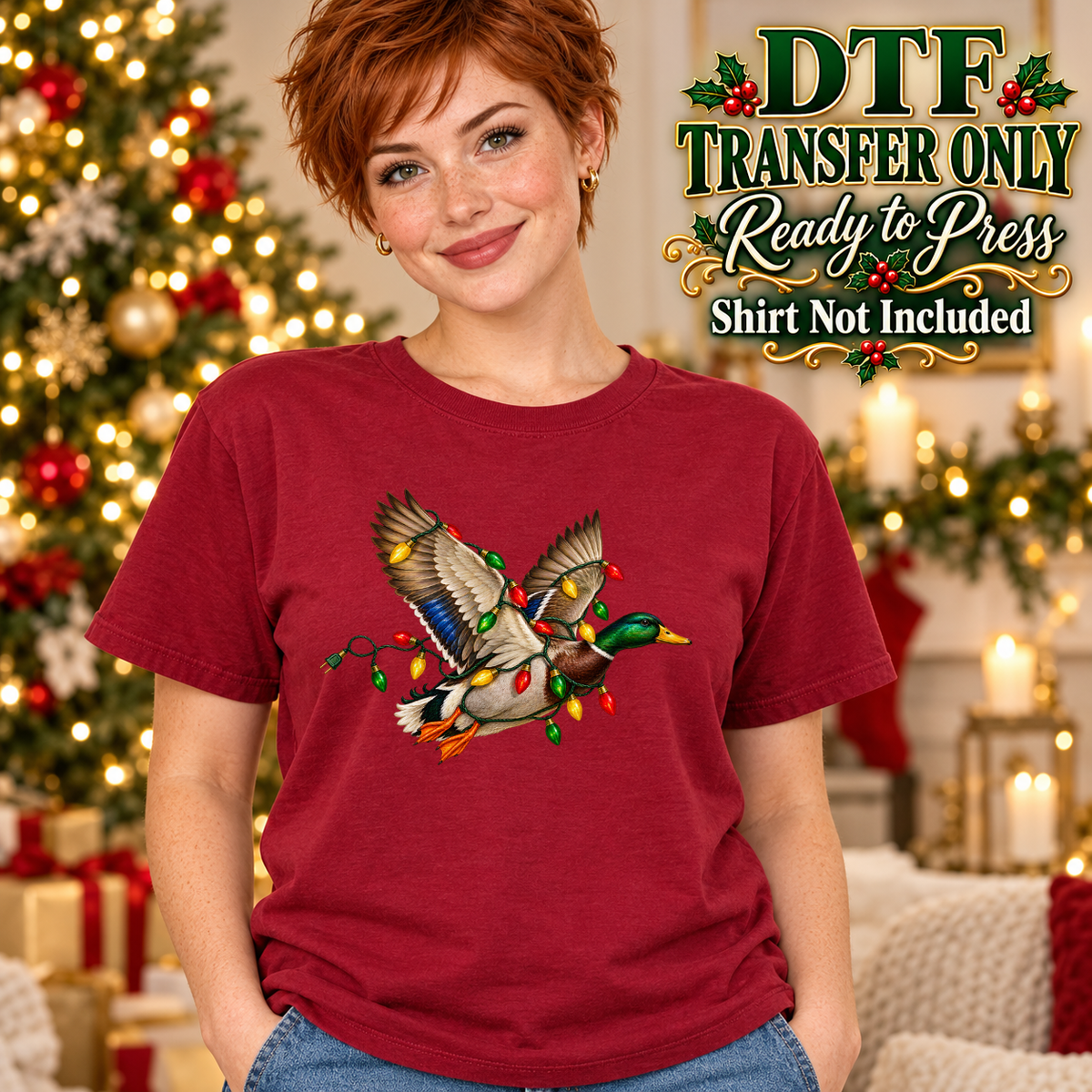 Model wearing a red shirt showing flying ducks wrapped with colorful Christmas lights; DTF transfer only, shirt not included.