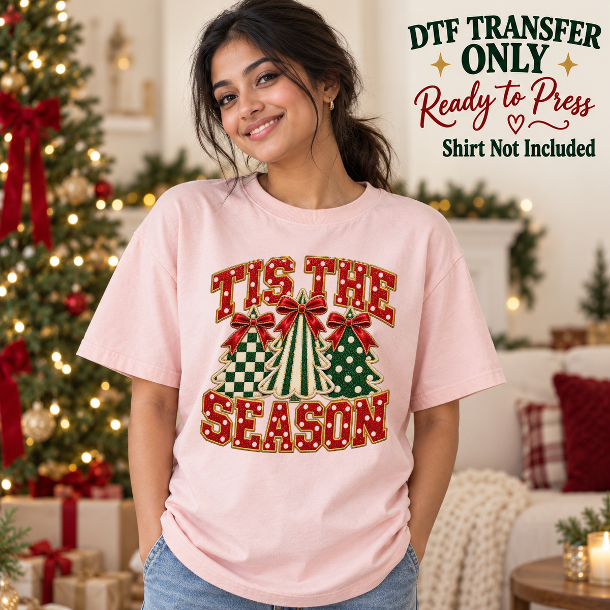 Model wearing a pink shirt with tis the season with three patterned christmas trees and bows; DTF transfer only, shirt not included.