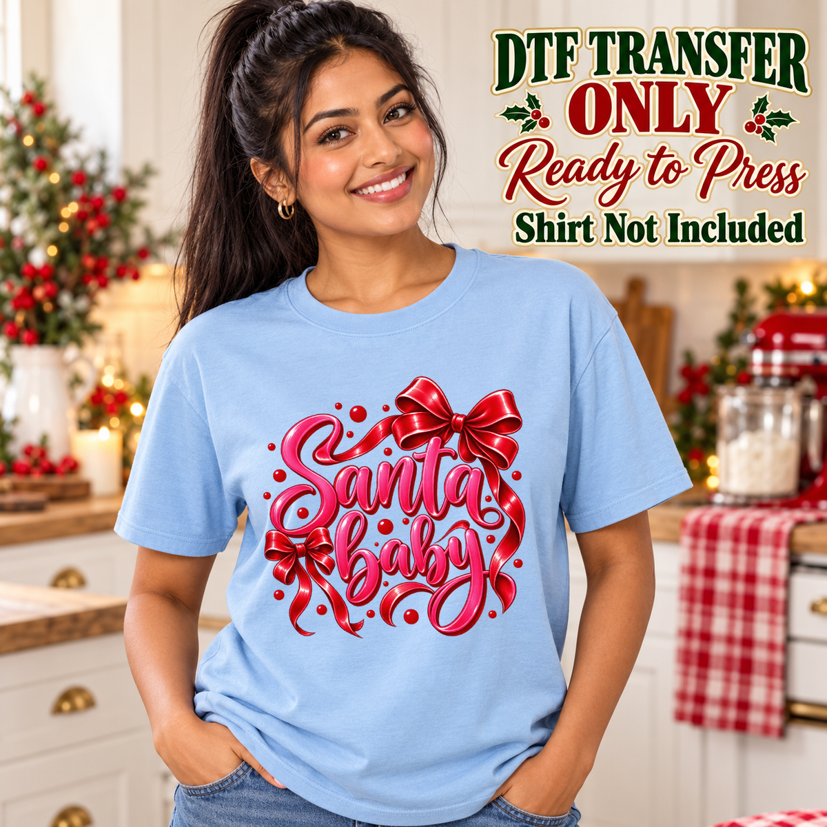 Model wearing a light blue shirt with santa baby red script with large red bow; DTF transfer only, shirt not included.
