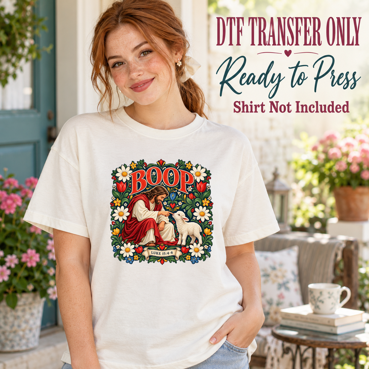 Model wearing a white shirt with boop lettering with jesus touching a lamb framed by flowers; DTF transfer only, shirt not included.