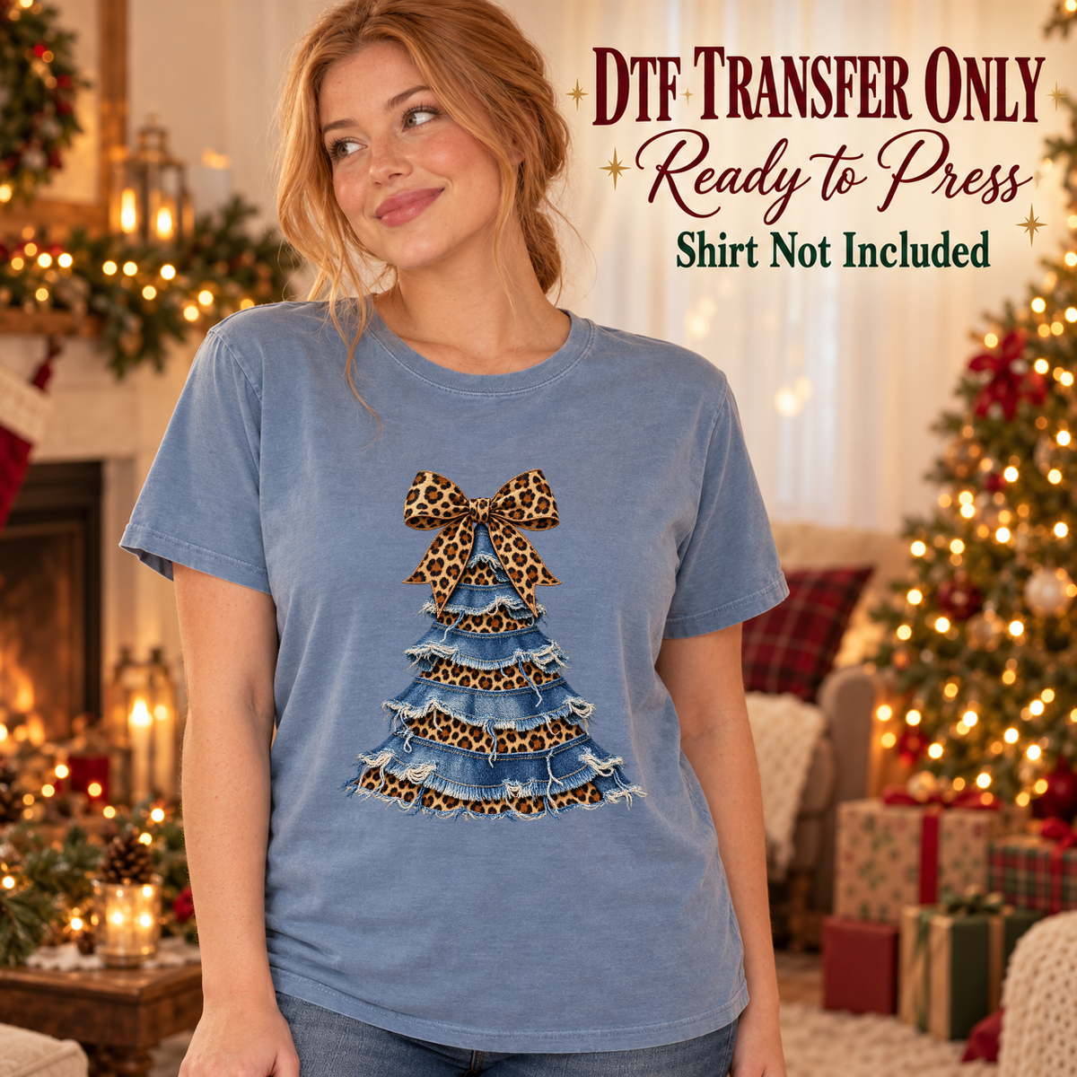 Model wearing a blue shirt with denim-look tiered christmas tree with leopard bow; DTF transfer only, shirt not included.