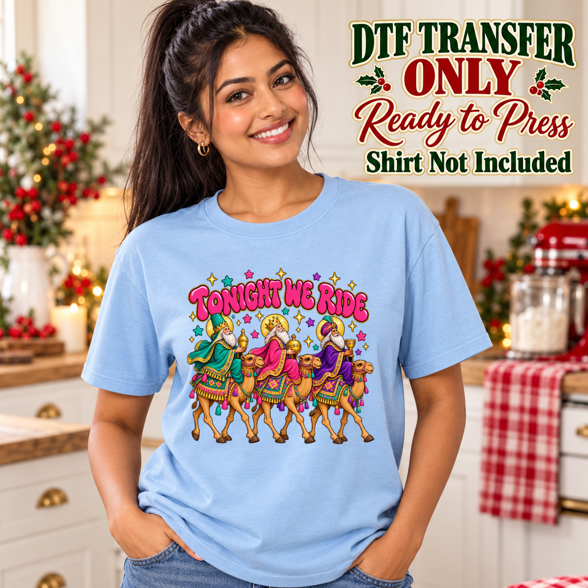 Model wearing a light blue shirt with tonight we ride above three decorated camels and riders; DTF transfer only, shirt not included.