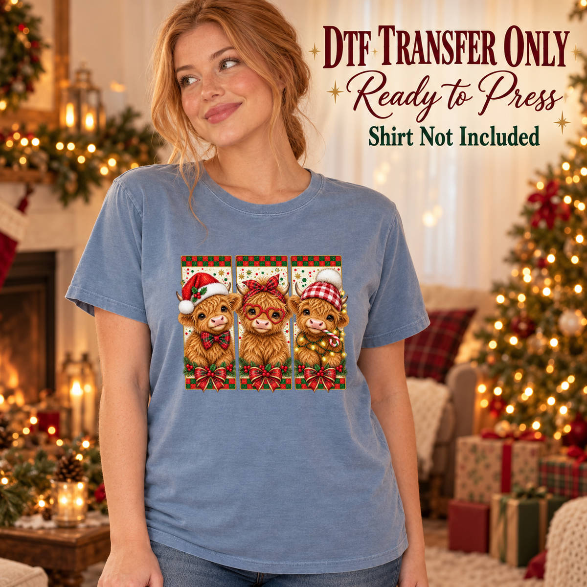 Model wearing a blue shirt with three christmas highland cows in red green panels; DTF transfer only, shirt not included.