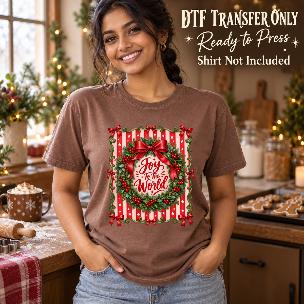 Model wearing a brown shirt with joy to the world in wreath with red bow and striped background; DTF transfer only, shirt not included.