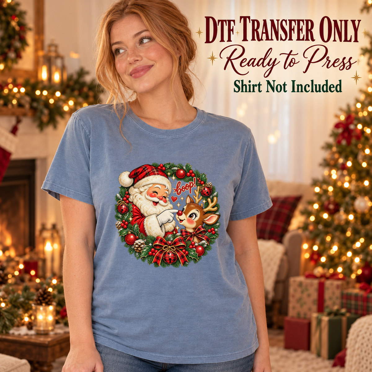 Santa and reindeer in a festive Joy wreath shown on a blue shirt worn by a woman; DTF transfer only, shirt not included.